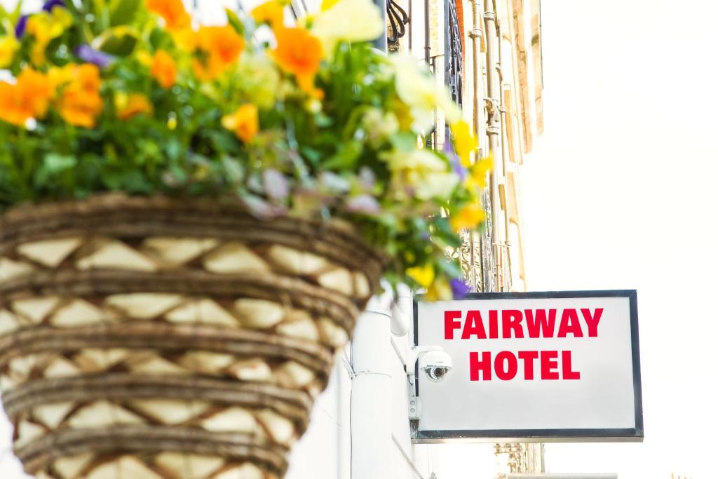 a street sign with flowers on it at Fairway Hotel in London