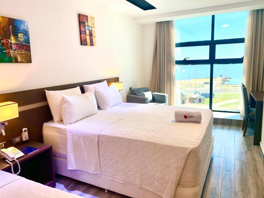 Postel nebo postele na pokoji v ubytování Hotel Sun