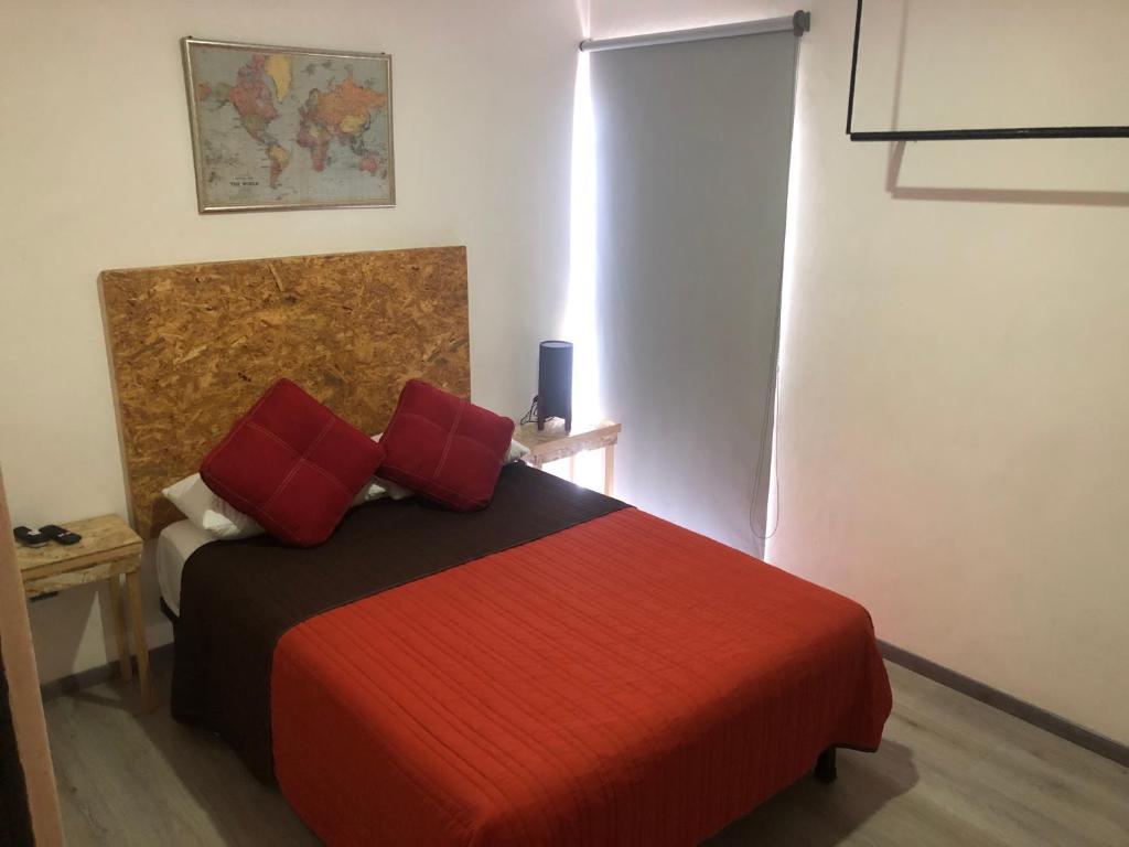 Postel nebo postele na pokoji v ubytování Hostal Hidalgo