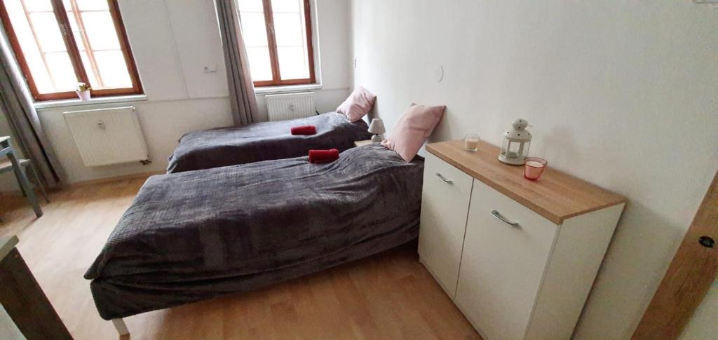 Postel nebo postele na pokoji v ubytování Old Town Apartments S12