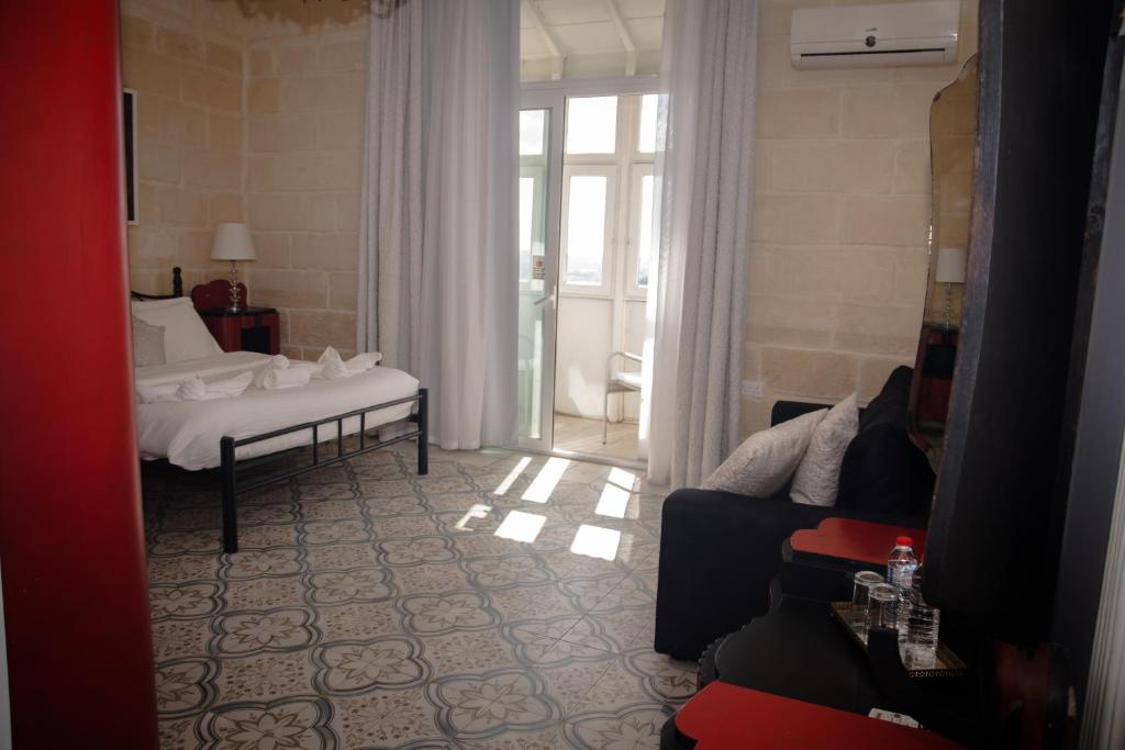Łóżko lub łóżka w pokoju w obiekcie Point de vue Guesthouse