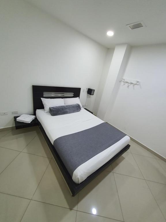 Postel nebo postele na pokoji v ubytování Hotel Laureles Park