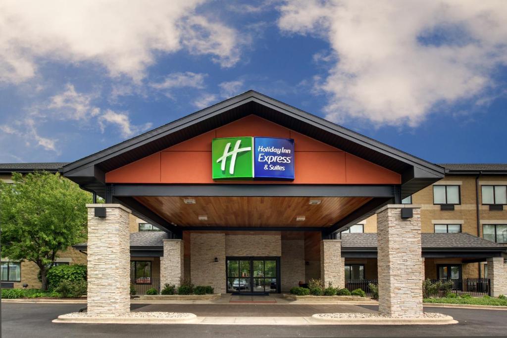 a building with a sign on the front of it at Holiday Inn Express & Suites Aurora - Naperville, an IHG Hotel in Aurora
