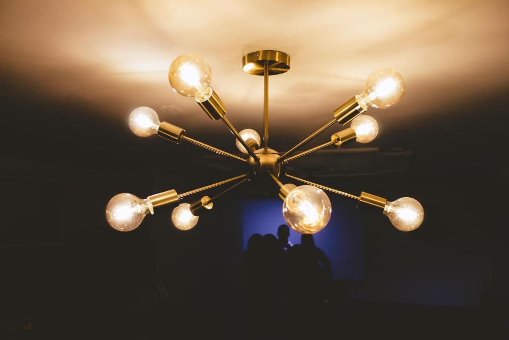 a chandelier hanging from the ceiling in a room at NOGAL HOSTEL in Pereira