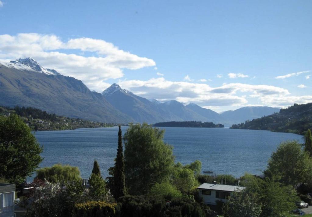 a view of a lake with mountains in the background at The Billiards Room in Queenstown