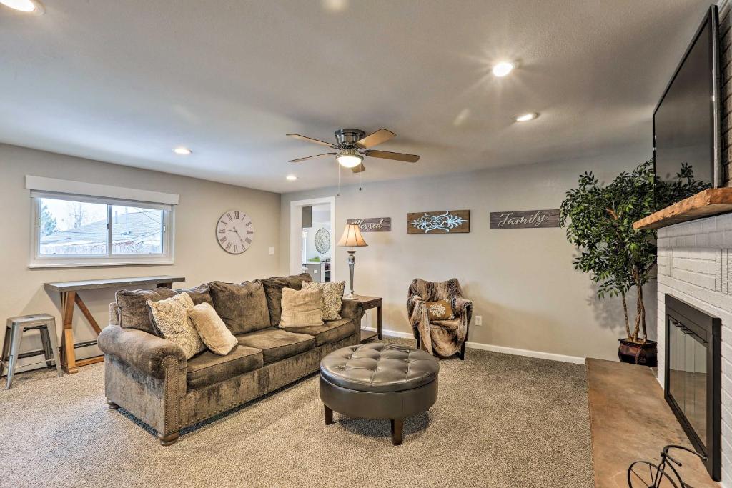 a living room with a couch and a fireplace at Dog-Friendly Ranch Retreat about 5 Mi to Denver! in Wheat Ridge