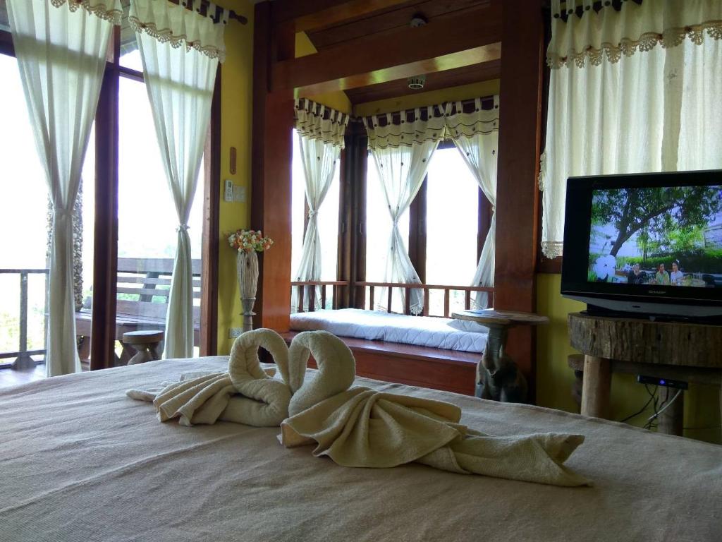 Postel nebo postele na pokoji v ubytování Khunyuam Resort