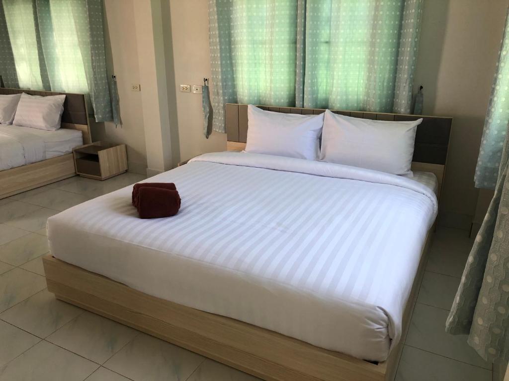 Postel nebo postele na pokoji v ubytování Seaside Home Khao Takiab