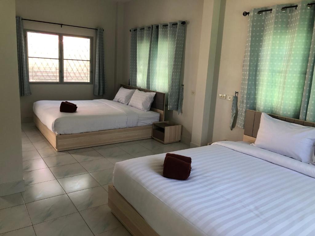 Postel nebo postele na pokoji v ubytování Seaside Home Khao Takiab