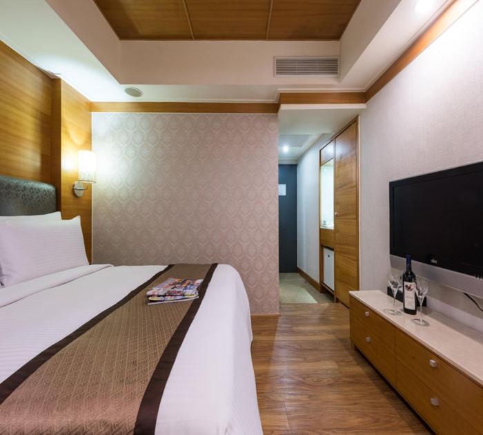 TV a/nebo společenská místnost v ubytování Forward Suites Ⅰ