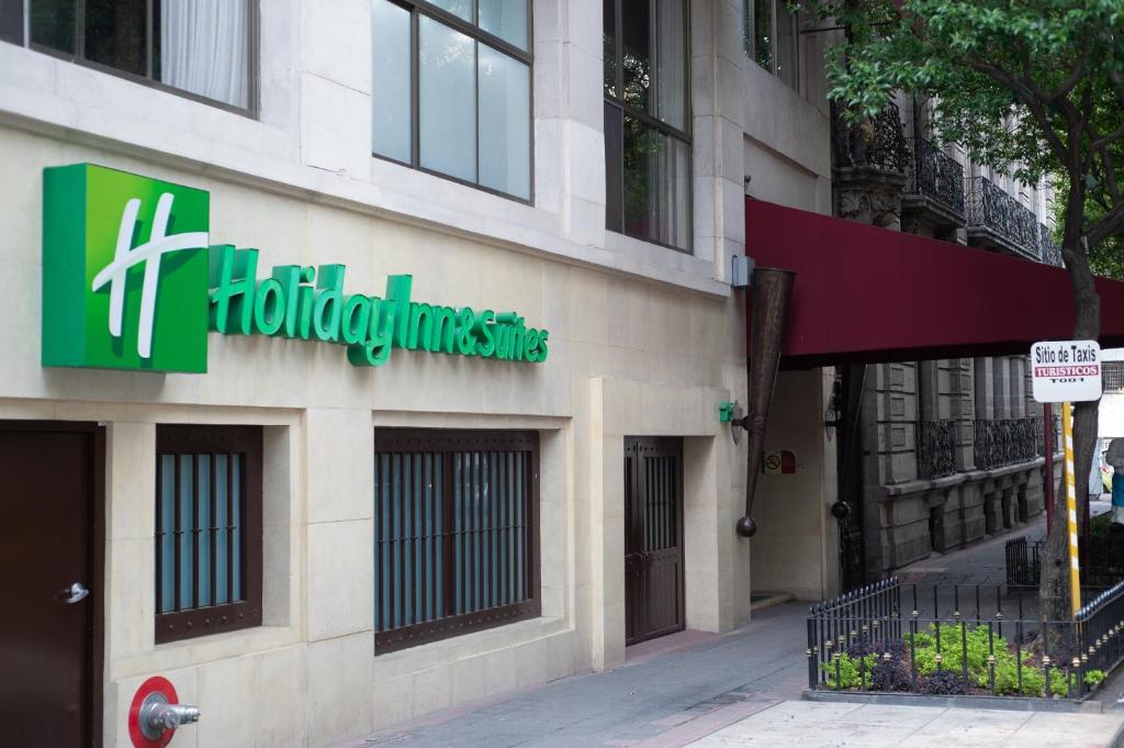 a building with a sign on the side of it at Holiday Inn & Suites Mexico Zona Reforma, an IHG Hotel in Mexico City