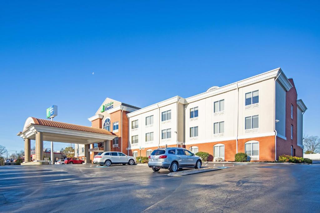 a car parked in a parking lot in front of a hotel at Holiday Inn Express & Suites Chattanooga - East Ridge by IHG in Chattanooga