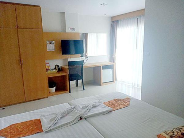 Postel nebo postele na pokoji v ubytování PKL Residence