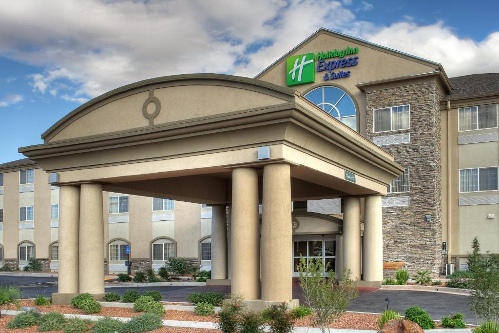 a front view of a hotel with a building at Holiday Inn Express Hotel & Suites Carlsbad, an IHG Hotel in Carlsbad