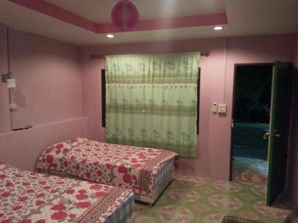 Postel nebo postele na pokoji v ubytování Nimmano resort at SuanPhueang