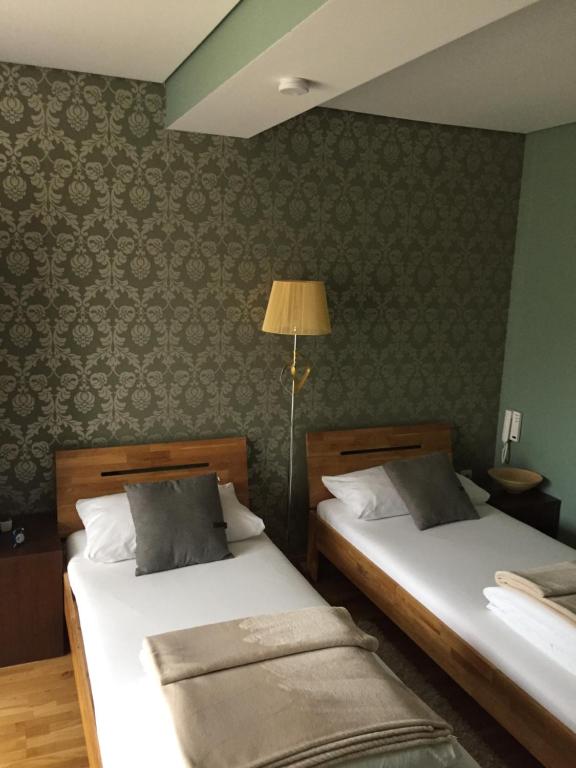 Postel nebo postele na pokoji v ubytování B&B Alex18