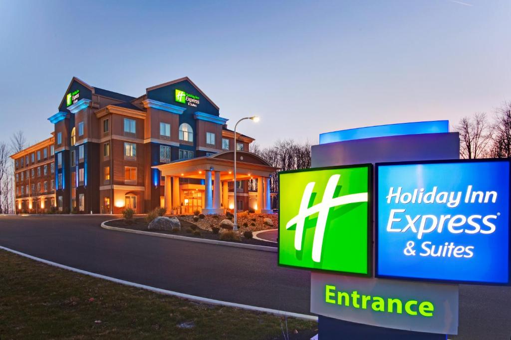 a hilton inn express and suites sign in front of a building at Holiday Inn Express Hotel & Suites Hamburg, an IHG Hotel in Hamburg