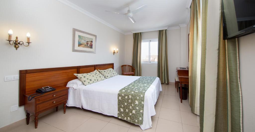 Postel nebo postele na pokoji v ubytování Hotel Marte