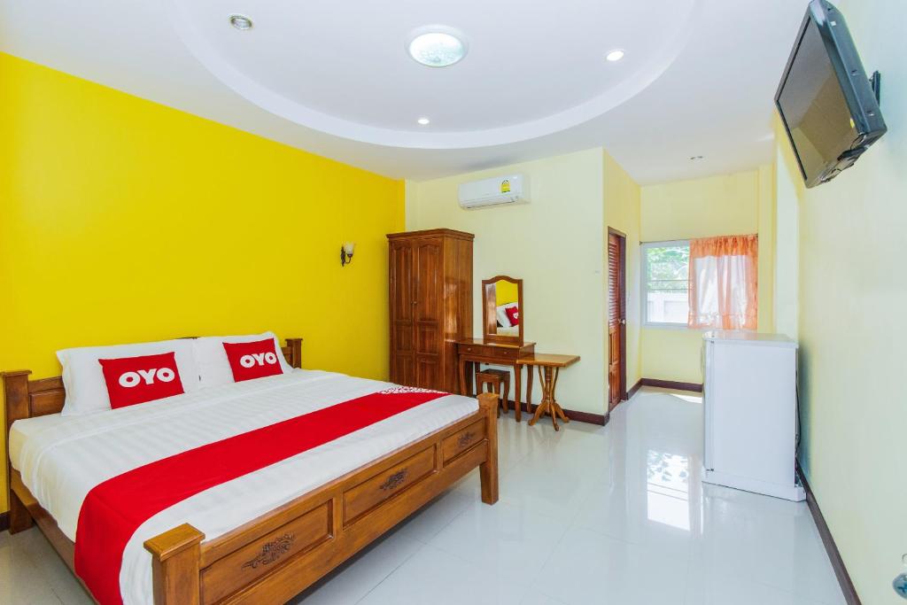 מיטה או מיטות בחדר ב-OYO 628 Dao Krajang