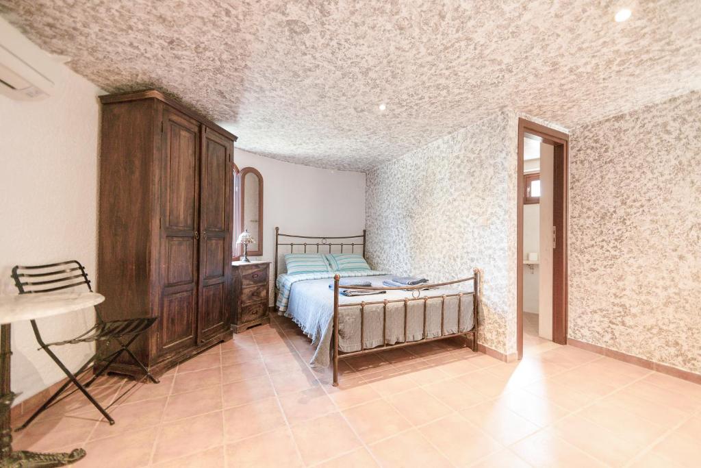Postel nebo postele na pokoji v ubytování Tsolis Village