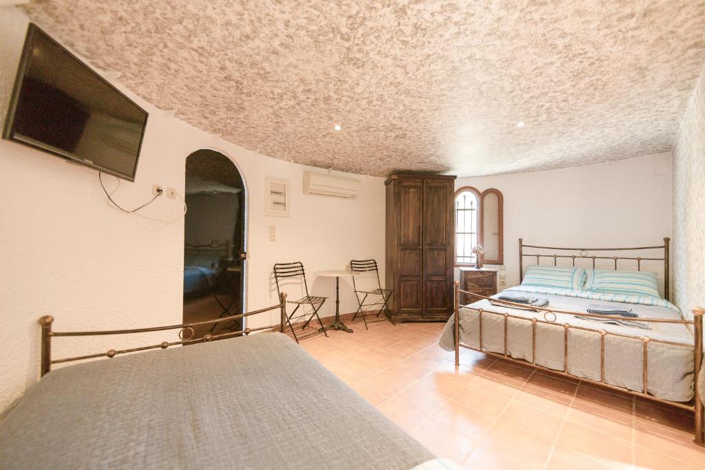 Postel nebo postele na pokoji v ubytování Tsolis Village