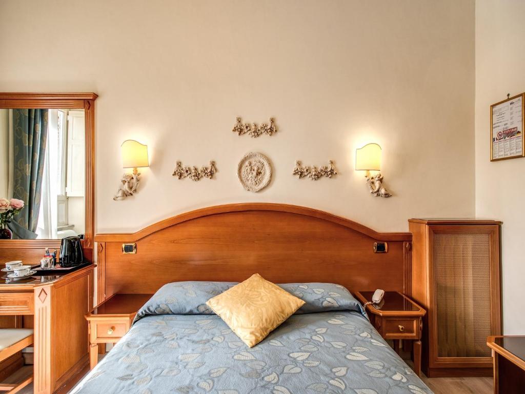 Voodi või voodid majutusasutuse Hotel Labelle toas