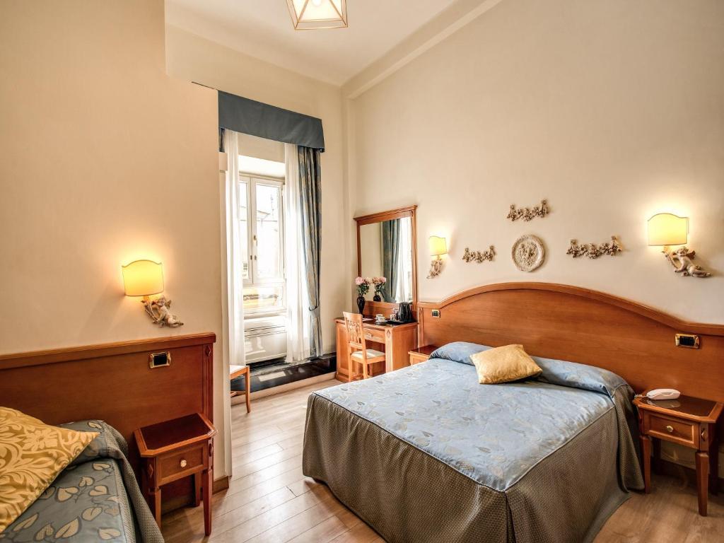 Voodi või voodid majutusasutuse Hotel Labelle toas