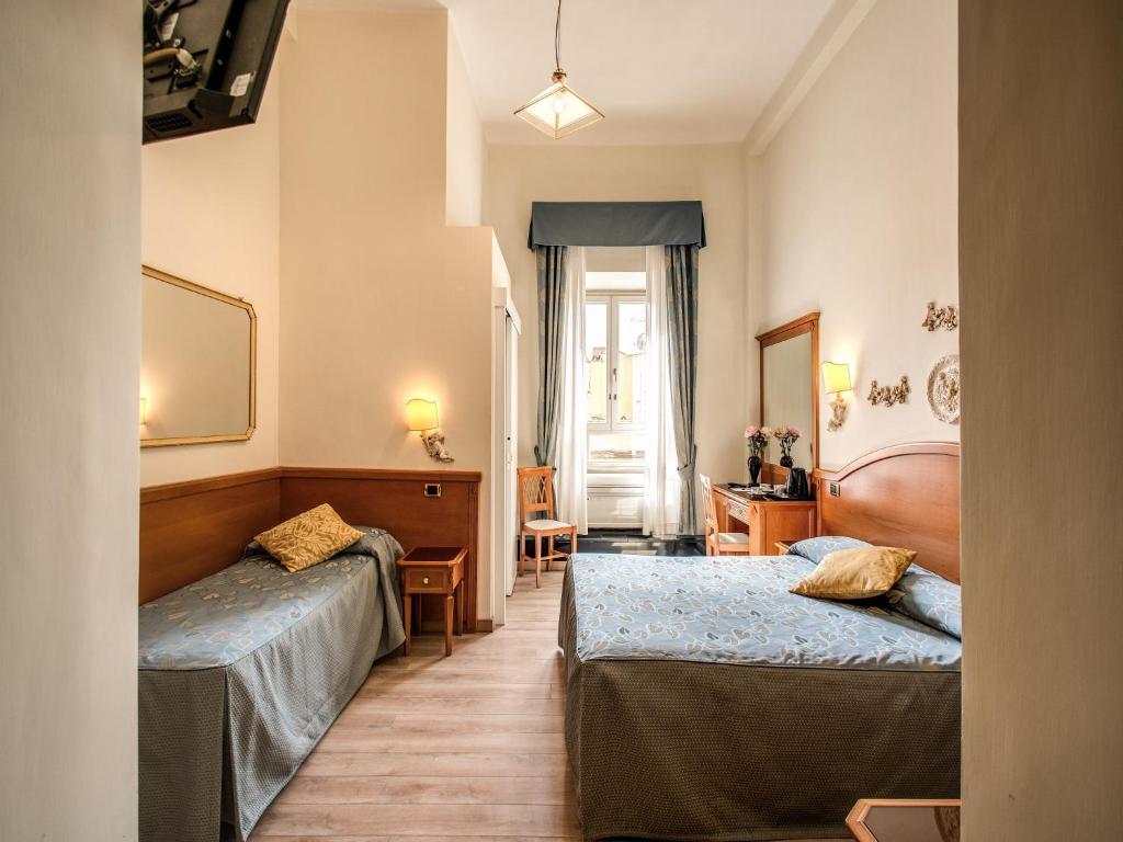 Voodi või voodid majutusasutuse Hotel Labelle toas