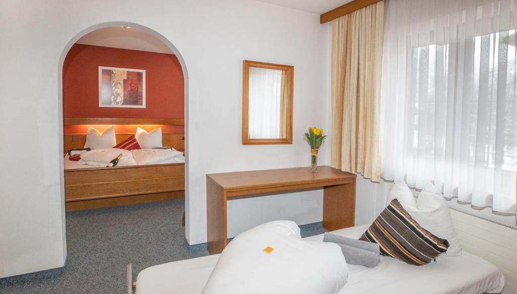 Postel nebo postele na pokoji v ubytování Hotel Untermetzger
