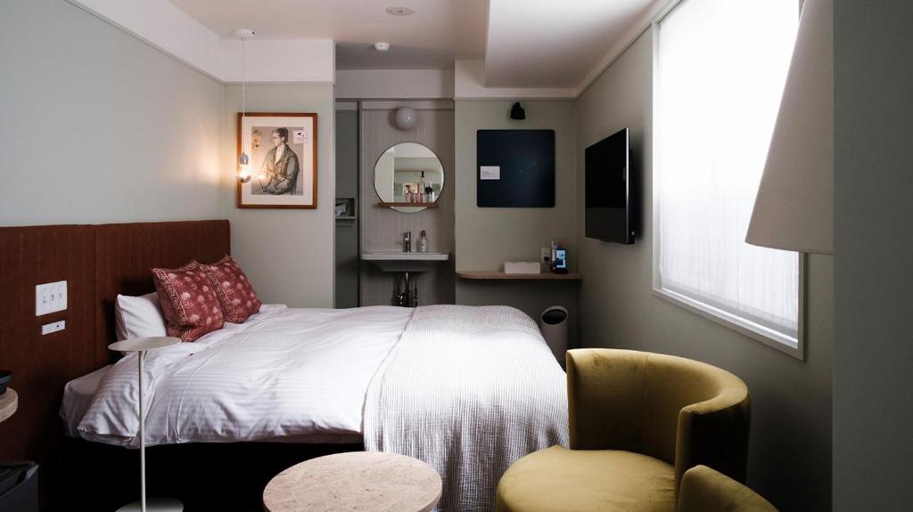 Postel nebo postele na pokoji v ubytování miss morgan hotel