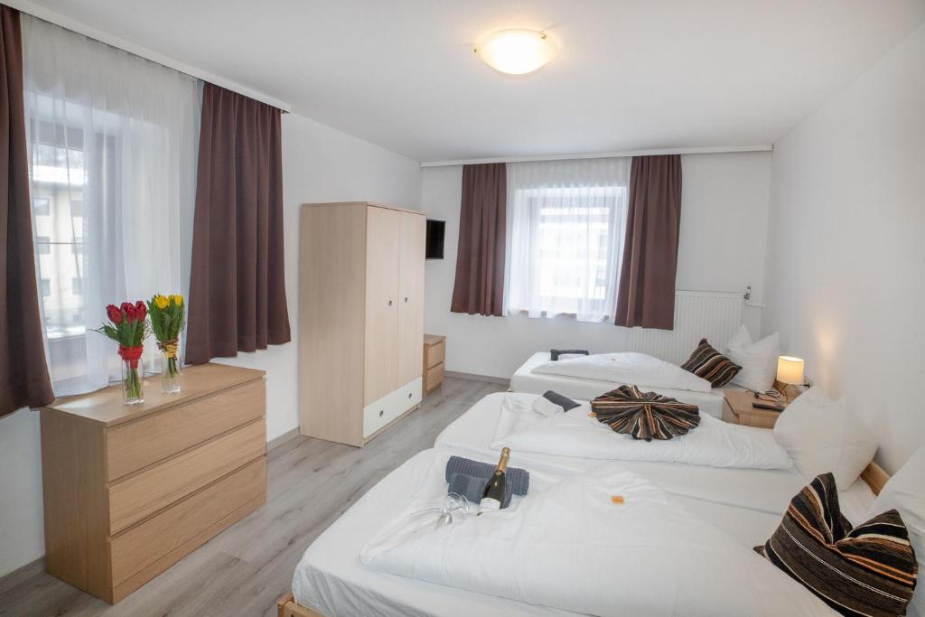 Postel nebo postele na pokoji v ubytování Hotel Untermetzger