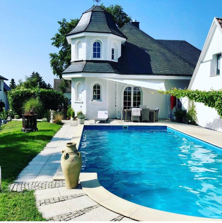 a swimming pool in front of a house at B OUR GUEST at NEW FLAT NEARBY DRESDEN !!!POOL!!! in Frauendorf