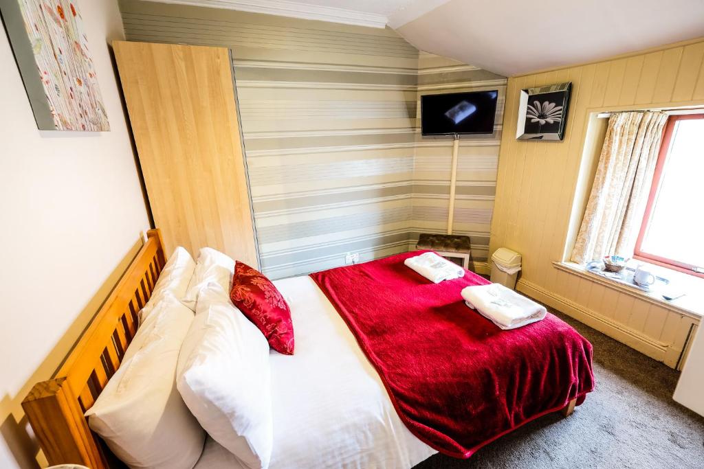 Postel nebo postele na pokoji v ubytování Balmore Guest House