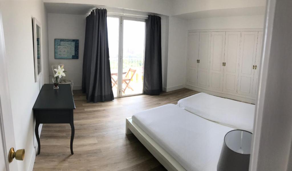 Postel nebo postele na pokoji v ubytování Apartamentos Bruja