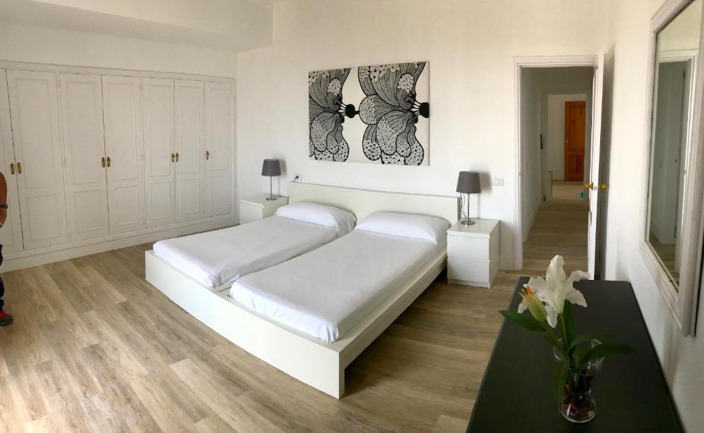 Postel nebo postele na pokoji v ubytování Apartamentos Bruja