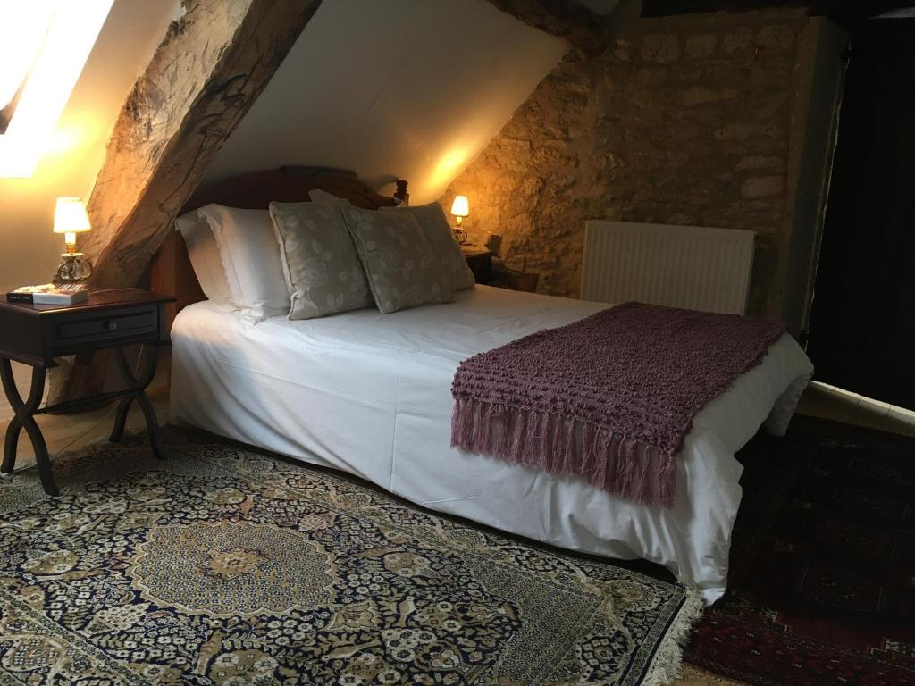 Postel nebo postele na pokoji v ubytování Pérard Chambres D’Hotes