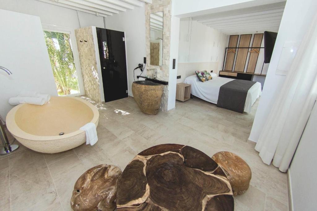 Postel nebo postele na pokoji v ubytování Botaniq Hotel Boutique