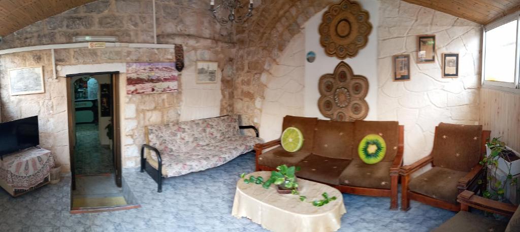 a living room with a couch and a table at Jaffa Gate Hostel in Jerusalem