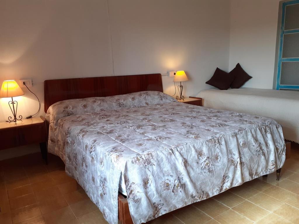 Postel nebo postele na pokoji v ubytování Casa Ombrina