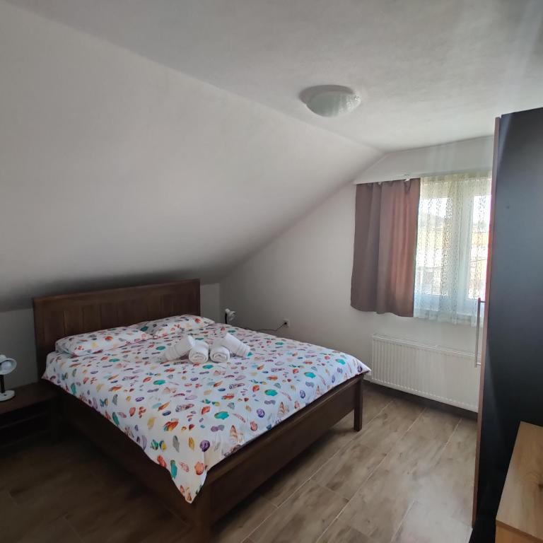 Posteľ alebo postele v izbe v ubytovaní Guest House Šapina