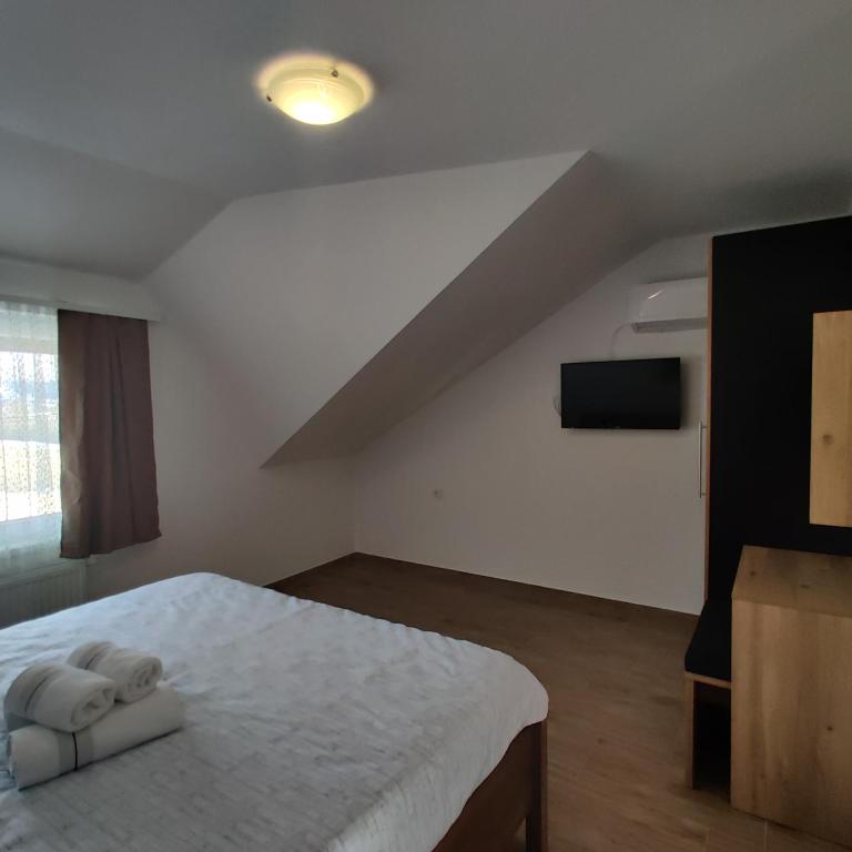 Posteľ alebo postele v izbe v ubytovaní Guest House Šapina