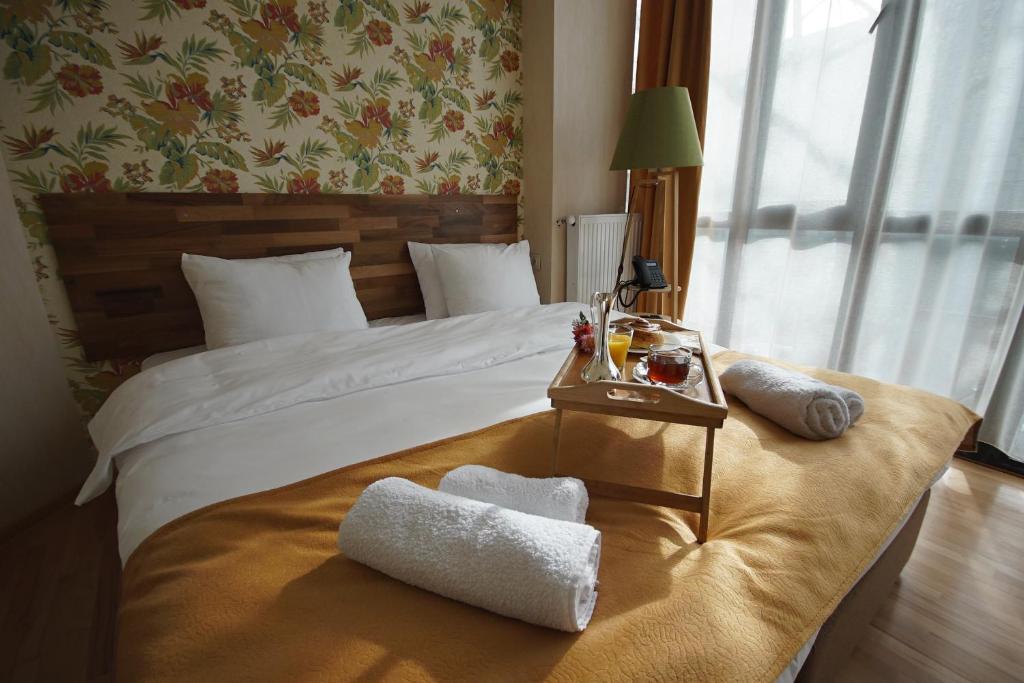 Postel nebo postele na pokoji v ubytování Hotel Cordata