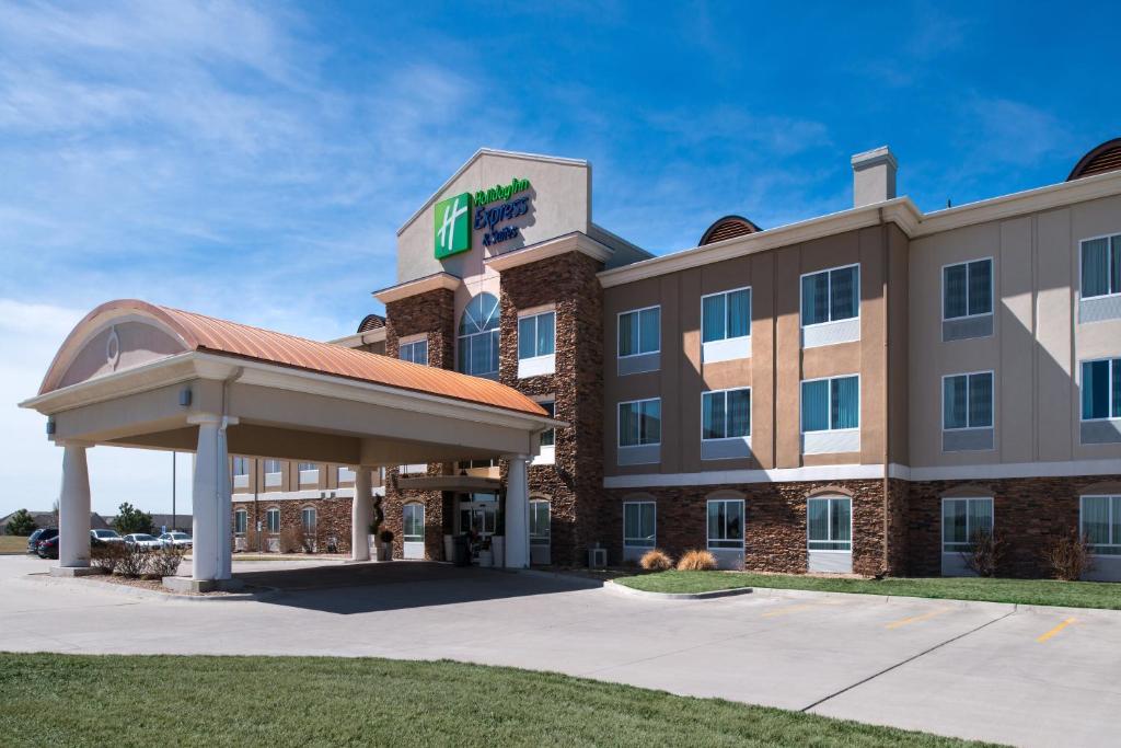 a hotel with a sign on the front of a building at Holiday Inn Express Northwest Maize, an IHG Hotel in Maize