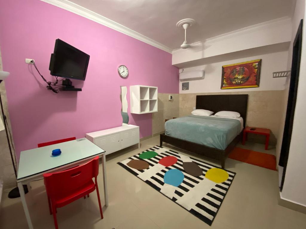 TV a/nebo společenská místnost v ubytování Apartahotel Guaraguao