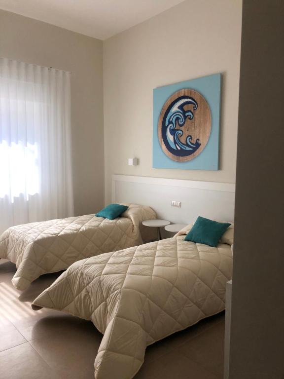 Postel nebo postele na pokoji v ubytování PalÈat-Manduria