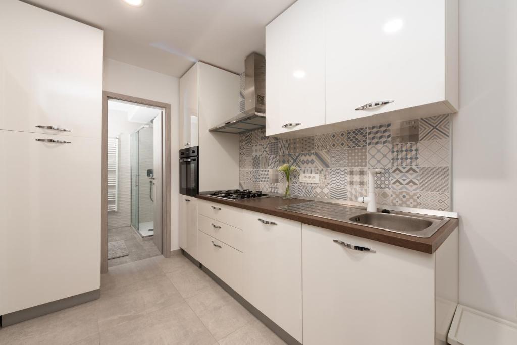 Kuchyň nebo kuchyňský kout v ubytování Apartment Stella