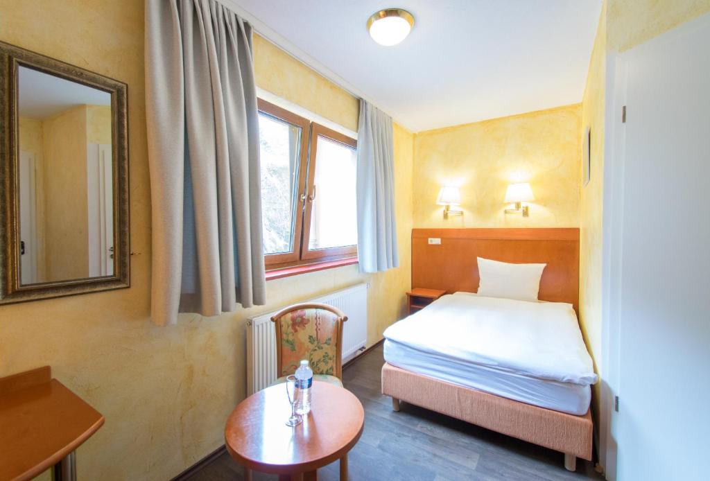 Postel nebo postele na pokoji v ubytování Aux Tanneries de Wiltz