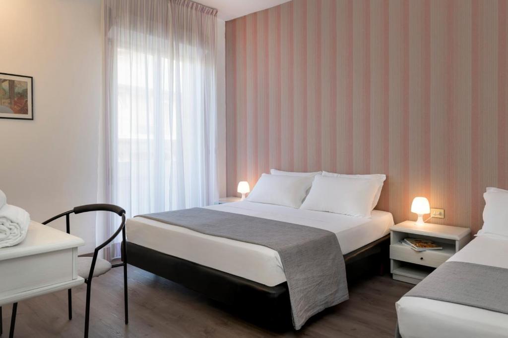 Postel nebo postele na pokoji v ubytování Hotel Cristina Corona