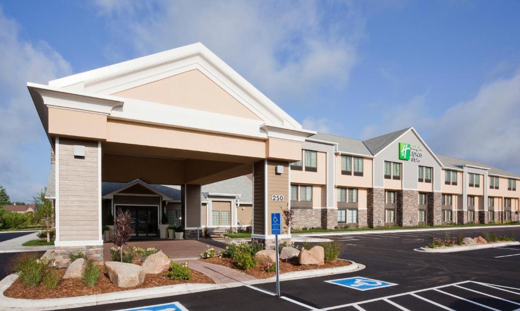 a rendering of a hotel with a parking lot at Holiday Inn Express & Suites Willmar, an IHG Hotel in Willmar