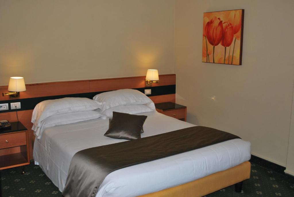 Postel nebo postele na pokoji v ubytování BV Hotel Oly